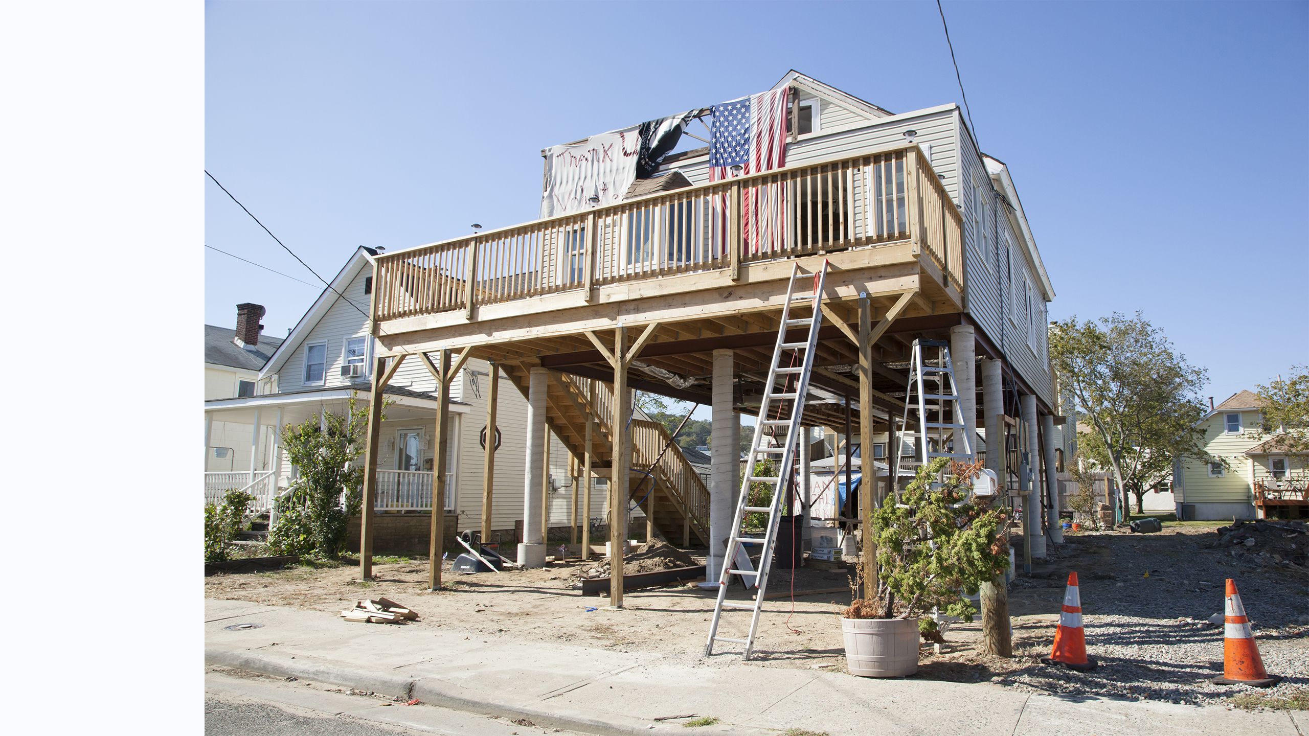 House being elevated on wooden stilts after Hurricane Sandy hit Highlands, New Jersey